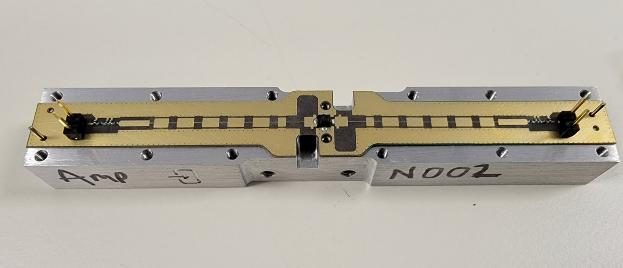 Machined amplifier chassis set during integration.