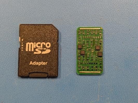 An MRDF MicroModule next to a microSD card: 24 channels of 4-bit phase shift and power amplification for a Ka-band phased array, in 0.61 × 1.08 × 0.12 inches.