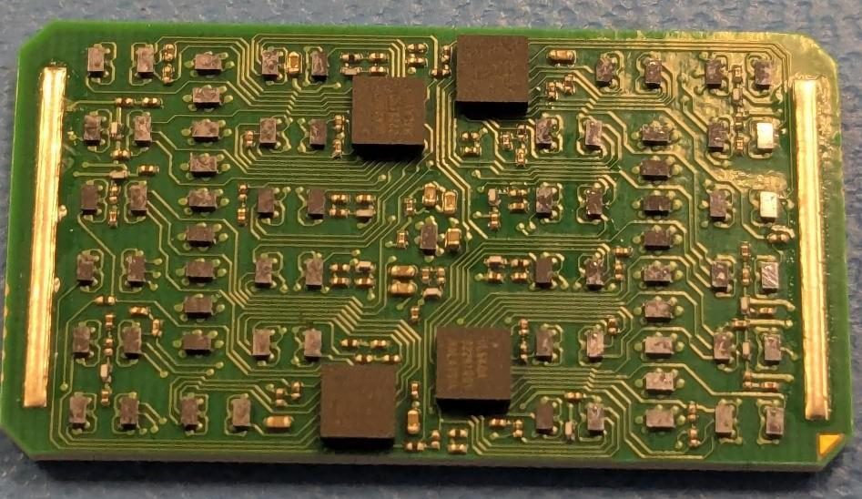 MicroModule top view. All RF paths are submerged in the module's 3D volume in individually shielded copper Faraday cages — only digital and power traces are visible.